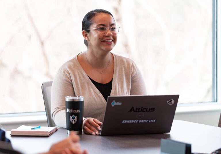Women sitting in front of a laptop computer